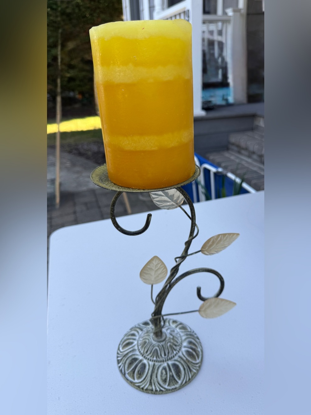 Yellow Pillar Candle on Decorative Leaf Metal Candle Holder - Home Accents